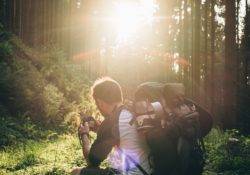 Backpacker sitting in the forest